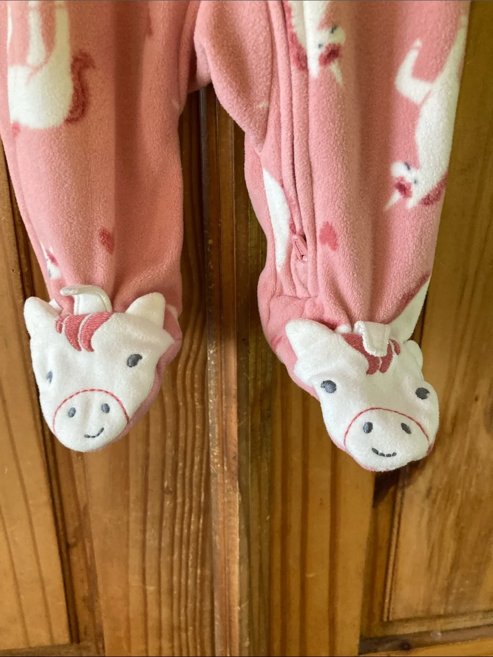 Girls Carter’s pink unicorn footed pajamas size newborn